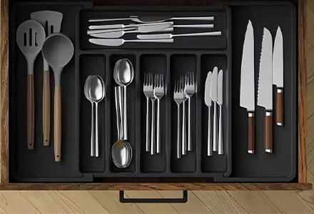 Cutlery storage box with compartments for forks, knives, spoons, and chopsticks