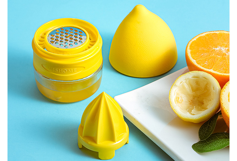 Lemon squeezer showing detachable base cup, strainer reamer, and lemon-shaped lid