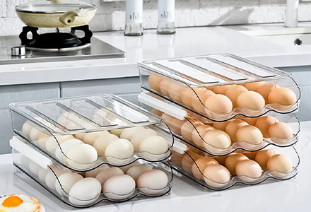 Stackable egg storage box with secure slots for fridge organization