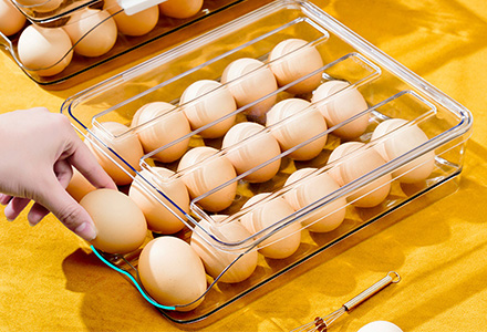 Stackable egg storage box with secure slots for fridge organization