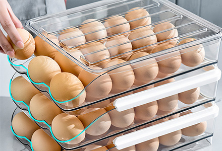 Stackable egg storage box with secure slots for fridge organization