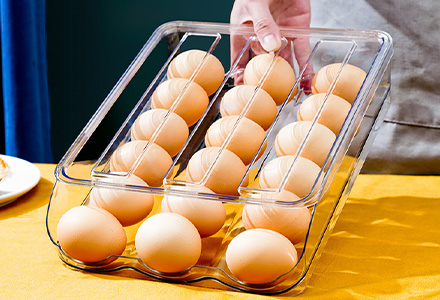 Stackable egg storage box with secure slots for fridge organization