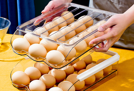 Stackable egg storage box with secure slots for fridge organization