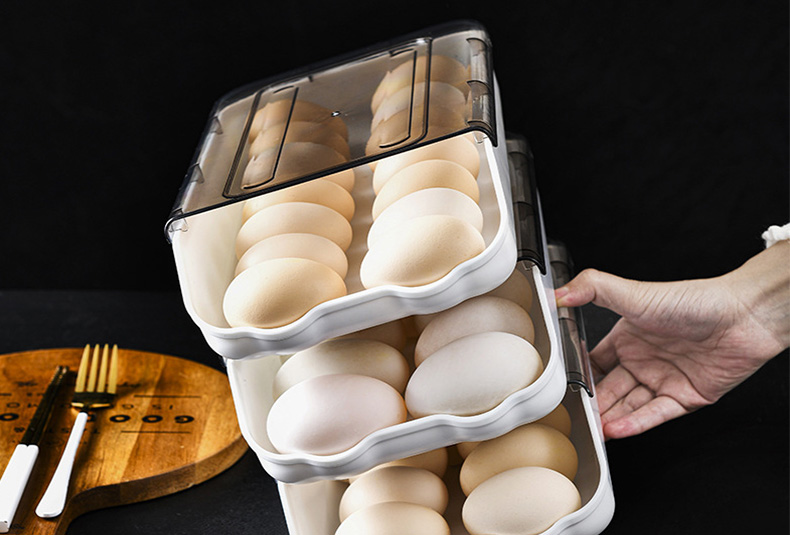 Stackable egg storage box with secure slots for fridge organization