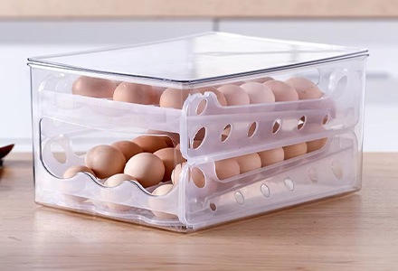 Stackable egg storage box with secure slots for fridge organization