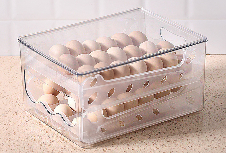 Stackable egg storage box with secure slots for fridge organization