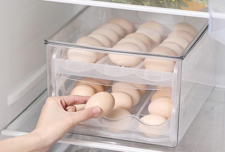 Stackable egg storage box with secure slots for fridge organization